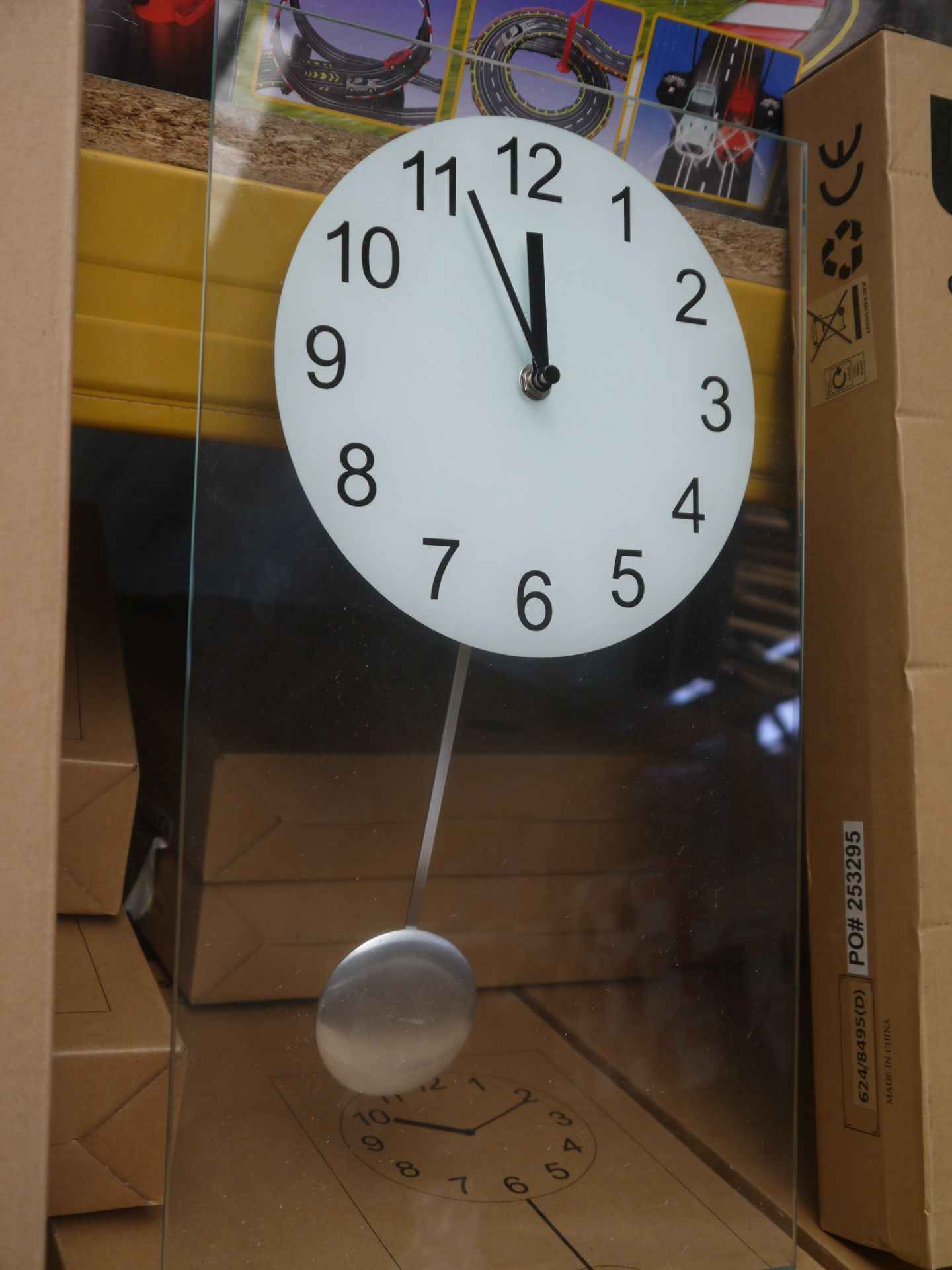 Living clear glass pendulum clock 45x25cm, boxed