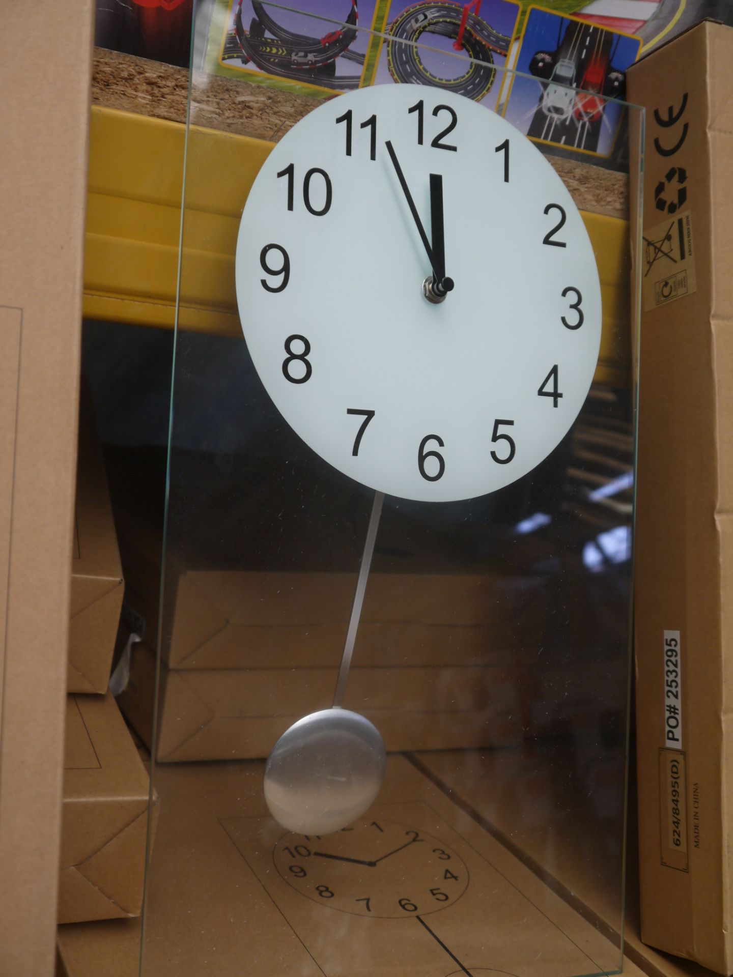 Living clear glass pendulum clock 45x25cm, boxed