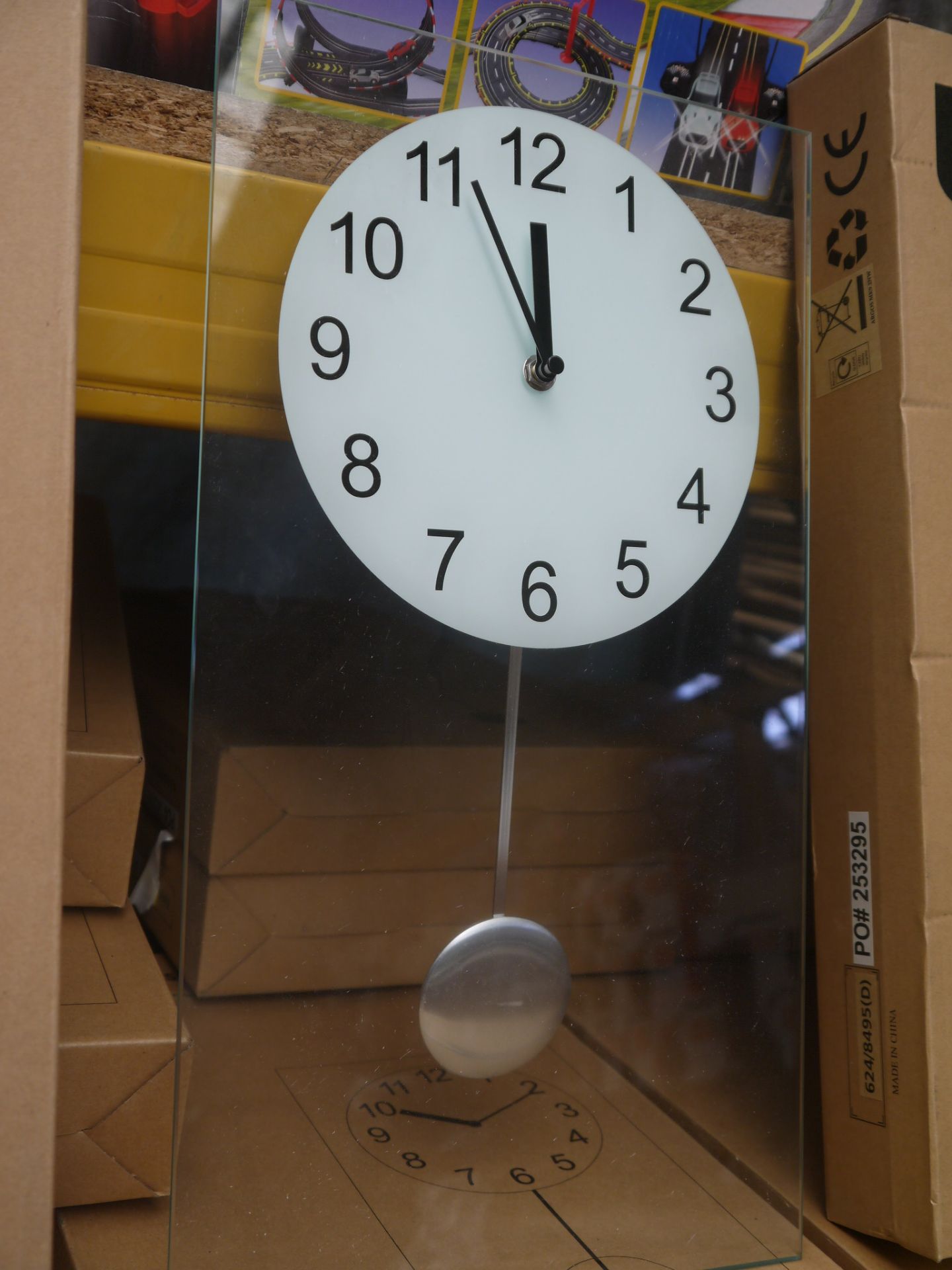 Living clear glass pendulum clock 45x25cm, boxed