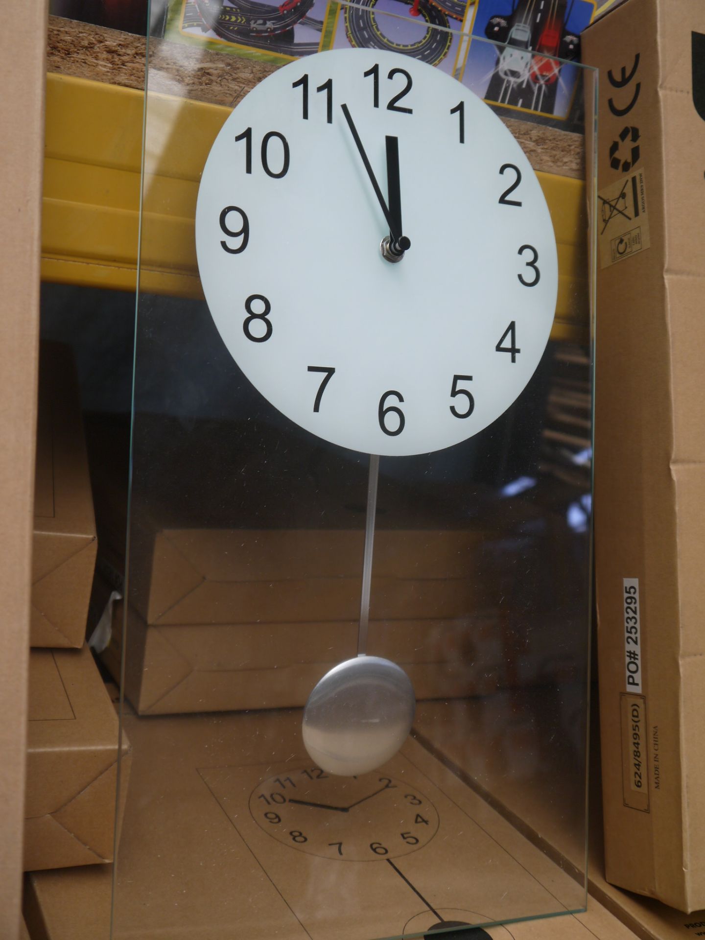 Living clear glass pendulum clock 45x25cm, boxed