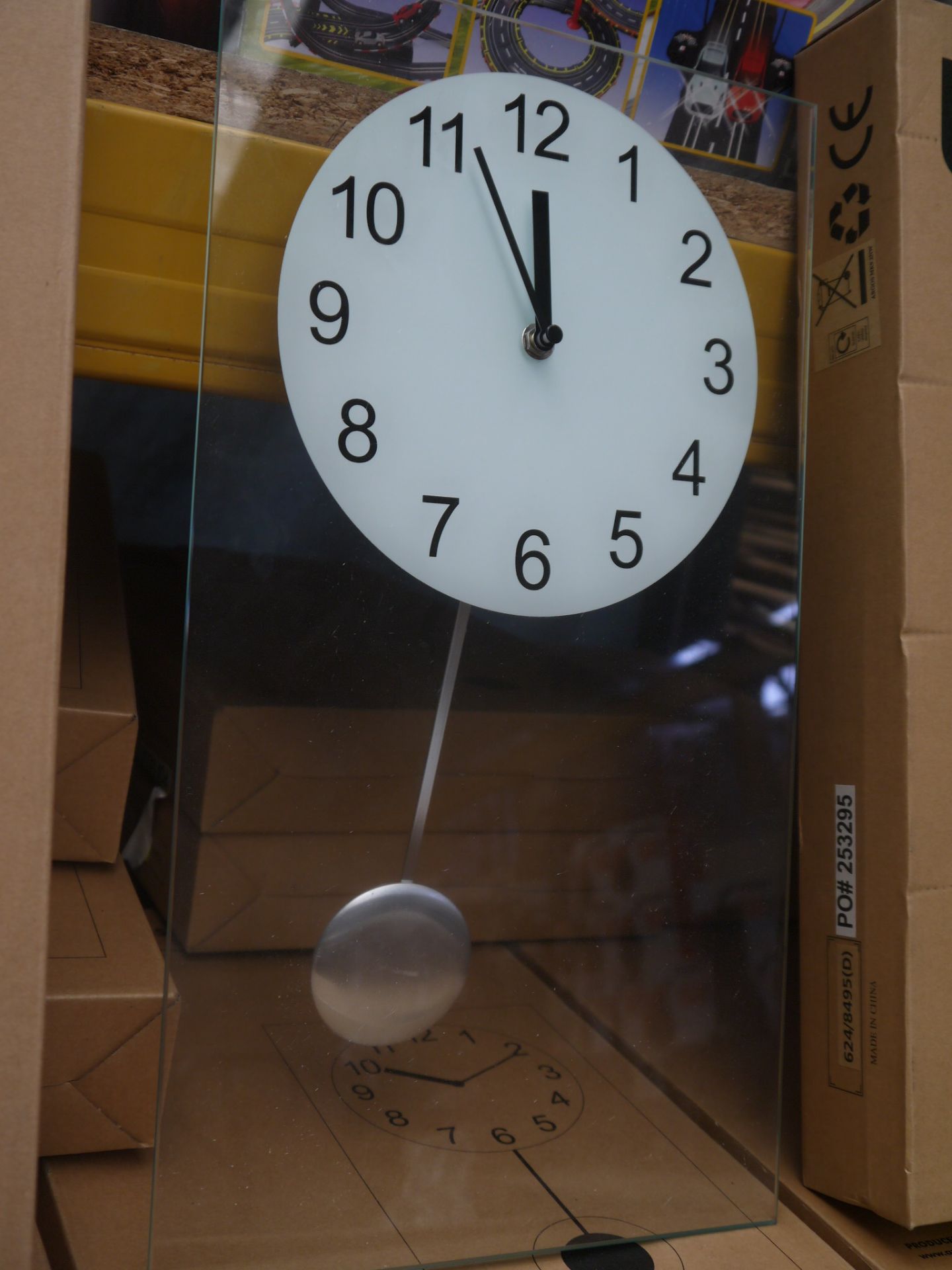 Living clear glass pendulum clock 45x25cm, boxed