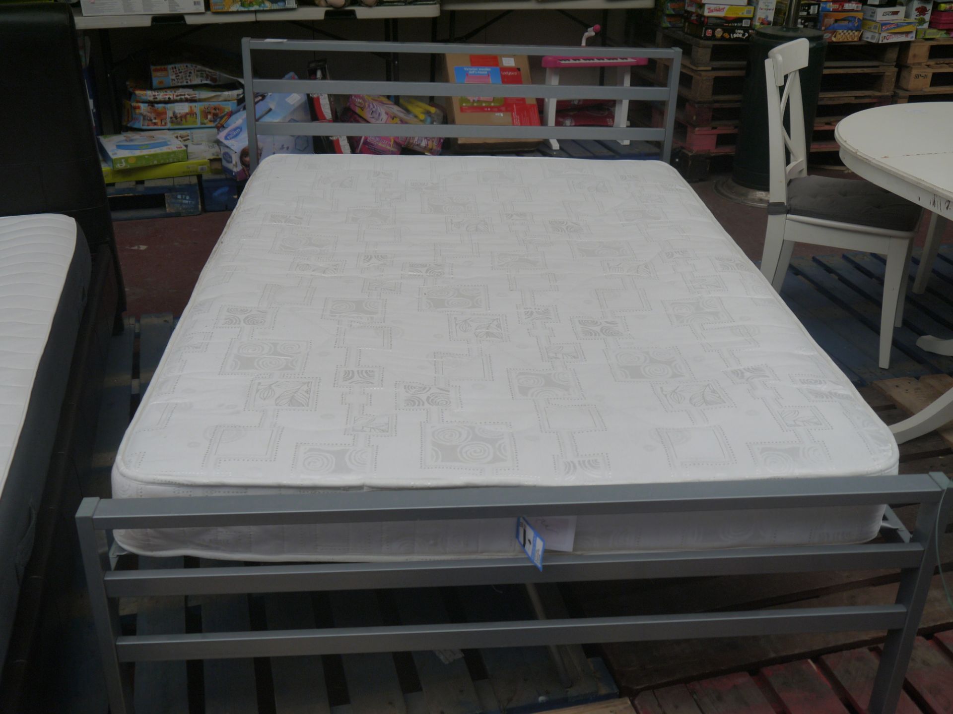 double sized metal bed frame plus a double sized mattress both look in good condition