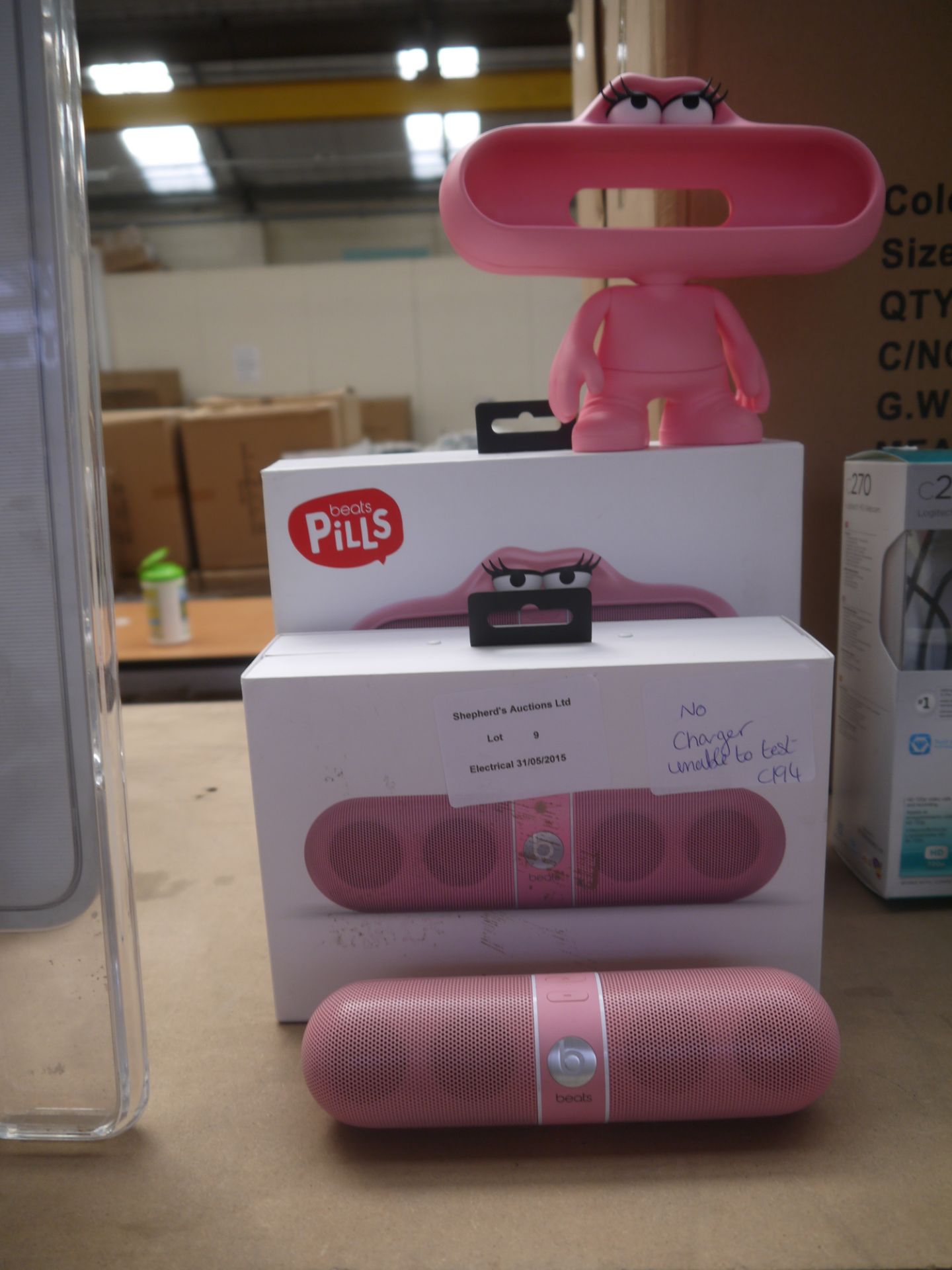 Beats Pill and Beats Pill holder both in Pink, cannot test the pill as there is no charger