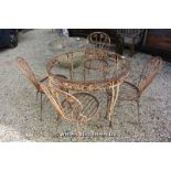 A CIRCULAR WROUGHT IRON GARDEN TABLE BASE AND A SET OF FOUR MATCHING CHAIRS