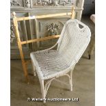 A WHITE PAINTED WICKER CHAIR AND A MODERN TOWEL RAIL