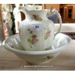 A FLORAL WASH JUG AND MATCHING BASIN