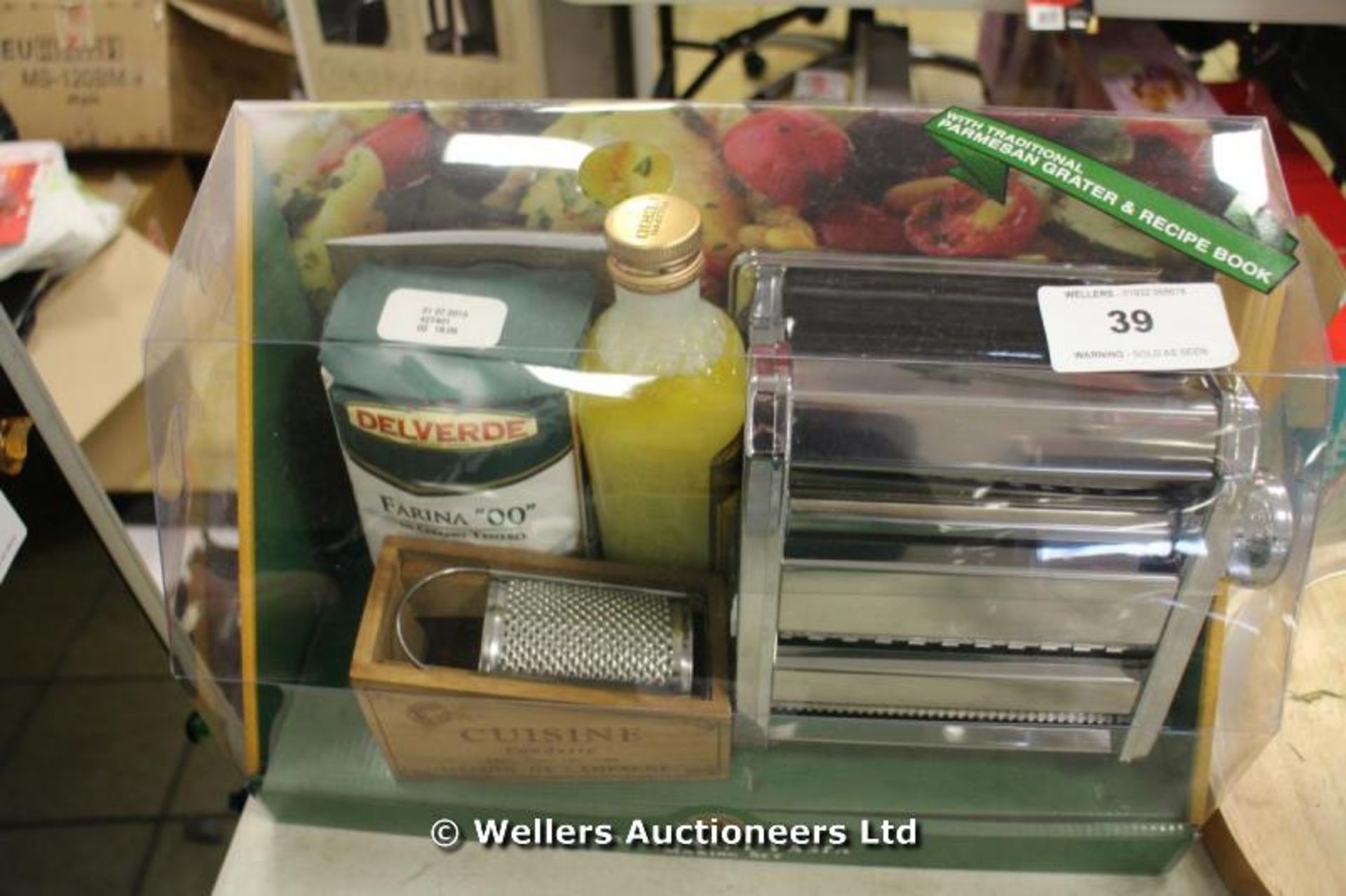 *PACKAGED PASTA MAKING KIT INCLUDING PASTA MACHINE, ORIGINAL PARMESAN GRATER, OLIVE OIL AND FLOUR.[