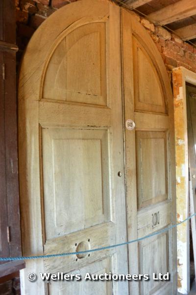 A PAIR OF LARGE OAK ARCHED TOP 6 PANEL DOORS