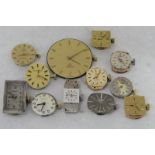 A quantity of branded watch movements and dials including; vintage Rolex fifteen jewel manual,