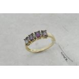Mystic topaz and diamond ring, four baguette cut mystic topaz each separated by two Swiss cut