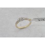 Three stone diamond ring, three round brilliant cut diamonds, estimated diamond weight 0.30ct,