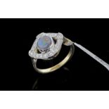 Black opal doublet and diamond dress ring, central round cabochon cut black opal doublet, surrounded