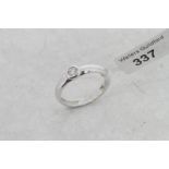 Single stone diamond ring, round brilliant cut diamond, rubover set in 18ct white gold, ring size K