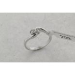 Two stone diamond twist ring, two round brilliant cut diamonds, mounted in 9ct white gold, ring size