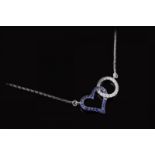 Sapphire and diamond set openwork pendant, designed as a sapphire set heart interlocking with a