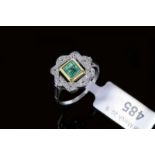 Emerald and diamond cluster ring, central rectangular step cut emerald with an old cut diamond