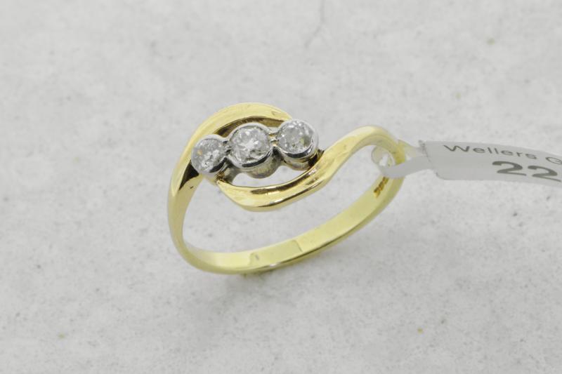 Three stone diamond twist ring, three old cut diamonds, mounted in 18ct yellow and white gold,