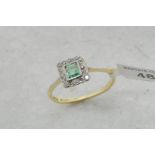 Emerald and diamond cluster ring, square cut emerald, surrounded by Swiss cut diamonds, set in