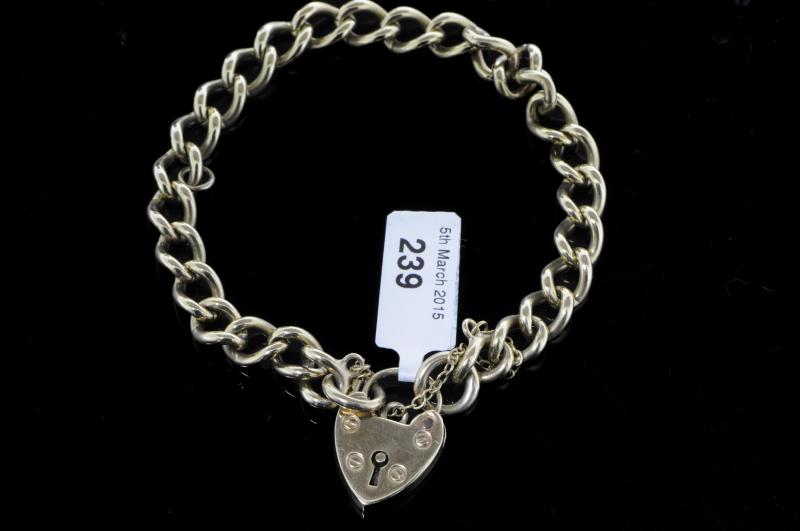 9ct yellow gold curb bracelet, with padlock clasp and safety chain, gross weight approximately 20