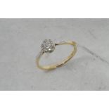 Old cut diamond cluster ring, seven old diamonds set in a flower cluster, mounted in yellow and