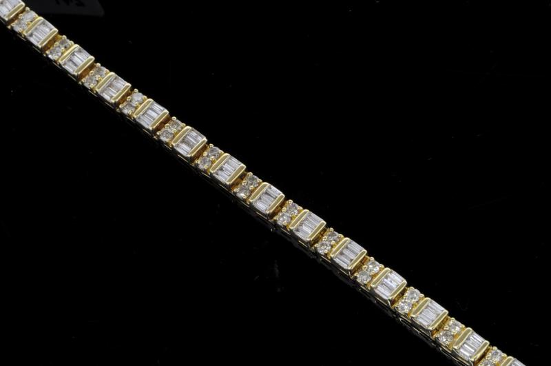 Fancy diamond set line bracelet, tapered baguette cut diamonds alternately set with round