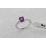 Pink sapphire and diamond ring, central cushion cut pink sapphire, with diamond set shoulders,