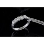 Five stone diamond ring, five round brilliant cut diamonds, estimated total diamond weight 0.70ct,