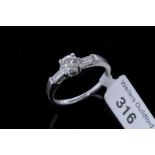 Single stone diamond ring, central round brilliant cut diamond weighing an estimated 0.55ct, with