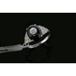 Onyx and diamond ring, oval cabochon cut onyx with a centrally set old cut diamond, with Swiss cut