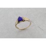 Lapis lazuli and diamond ring, central shield shaped lapis lazuli plaque, with four brilliant cut