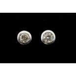 Single stone diamond stud earrings, round brilliant cut diamonds, estimated total diamond weight 0.