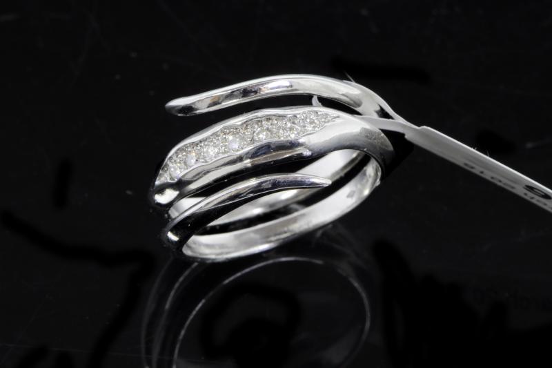 Diamond dress ring, seven round brilliant cut diamonds centrally set in a coil shank, mounted in