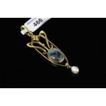 Art Nouveau style pendant, set with an oval cabochon green hardstone and a suspended cultured pearl,