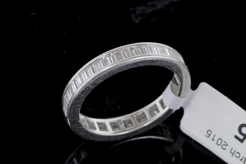 Diamond full eternity ring, baguette cut diamonds weighing an estimated total of 1.50cts, channel