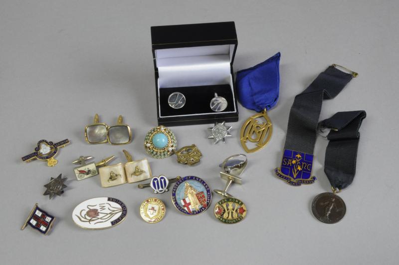 Selection of costume jewellery, including cufflinks, brooches and three medals