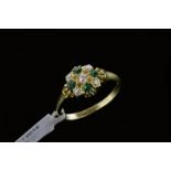 Emerald and diamond cluster ring, set with four circular cut emeralds and five old cut diamonds,