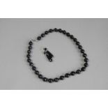 Single row banded agate and black bead necklace, with matching drop earrings