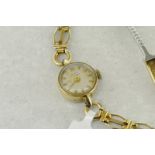 Ladies' 9ct yellow gold Girard-Perregaux wristwatch, round white dial with baton hour markers,