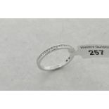 Diamond half eternity ring, round brilliant cut diamonds channel set in 9ct white gold, ring size N