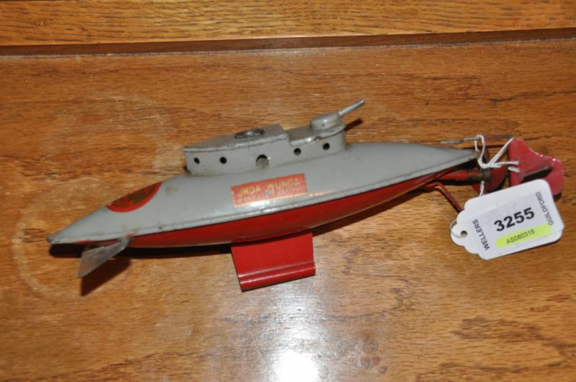 A Sutcliffe 'UNDA WUNDA' tinplate submarine