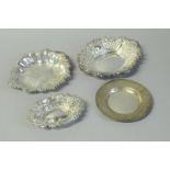 *Four silver dishes; one leaf shaped, Birmingham 1971, two with c-scroll borders, London 1971 and