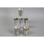 *Judaica - A set of three Russian white metal kiddush cups, stamped 1890, with another set of