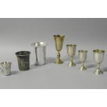 *Judaica - A set of three silver kiddush cups, London 1937, together with four additional silver