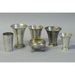 *Five Swedish white metal cups and an engraved salt cellar, hallmarked 1824 and later, gross