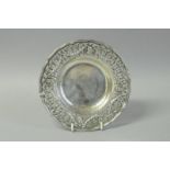 *A Hanau silver dish, the pierced border with medallions and swags in 18th century style, early 20th