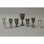 *Judaica - A collection of seven silver stemmed kiddush cups various dates and makers, gross