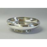 A hammered silver bowl, by Edward Barnard & Sons, London 1921, gross weight approximately 623 grams