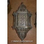 AN ISLAMIC BRASS HANGING PORCH LIGHT WIRED FOR ELECTRICITY WITH PROFUSE PIERCED DECORATION, 600