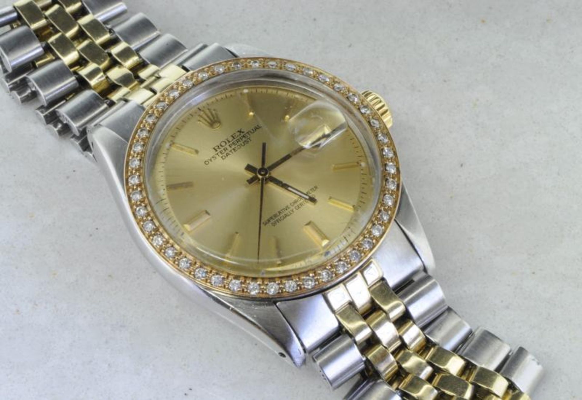 Gentlemen's Rolex Oyster Perpetual Date, silvered dial with baton hour markers, after market diamond