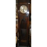 A mid 20th century oak longcase clock with metallic dial and oval glazed cabinet, 155cm high